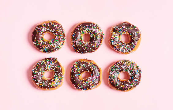 Choclolate Sprinkle Donuts on Pink Background 