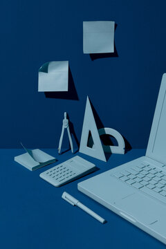 Still life of technical drawing objects in blue tones