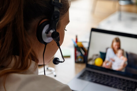 Crop medic having telemedicine appointment via laptop
