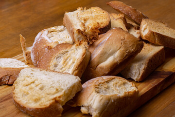 slices of toasted rustic bread on wooden board