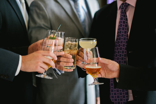 Group of anonymous businessmen toasting