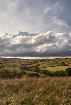 Clouds over farmlamd. Derbyshire Dales, Peak District, UK.