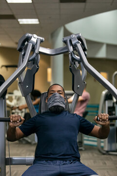 Gym: Man Wears Mask While Working Bench Press