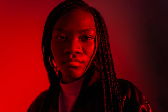 Studio Portrait Of A Young Woman In Red. 