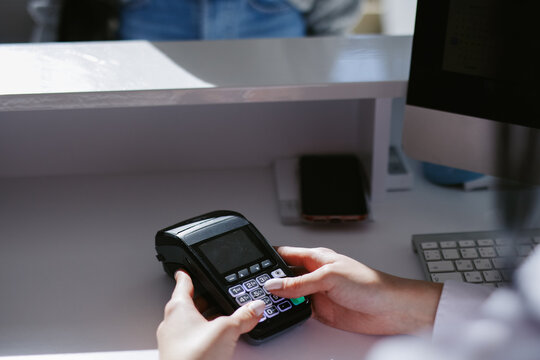 Employee inserting keys on contactless terminal 