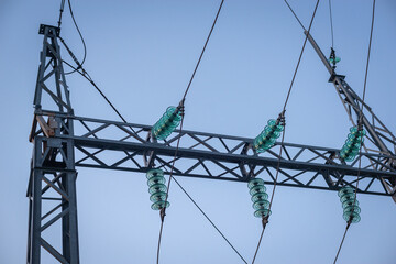 Electric pole with wires in the evening.