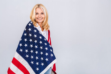 Smiling senior beautiful patriotic woman wearing united states flag isolated over white background with a surprise face.