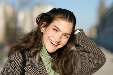 Gorgeous Young Woman Touching Her Hair 