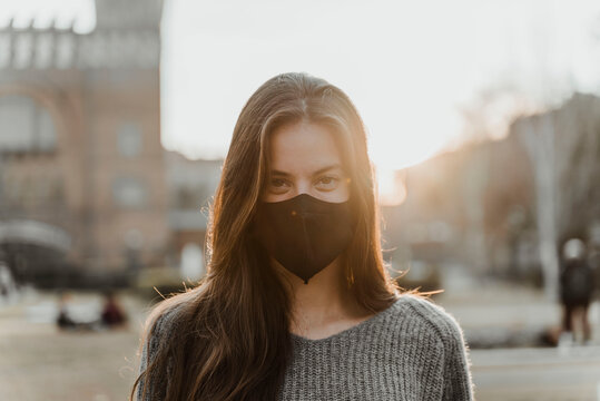 Portrait of young woman wearing face mask.