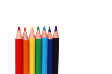 colour pencils in a row on a white background