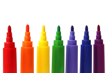 colored markers in a row on a white background
