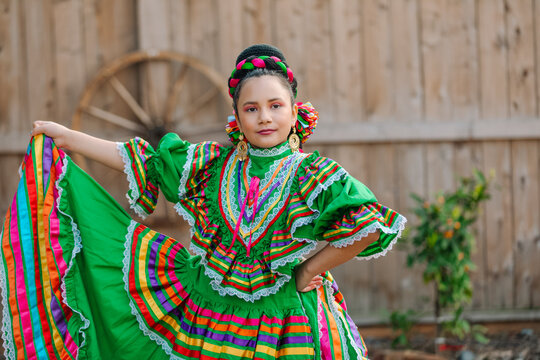 Portrait of a Mexican-American girl dressed up with a Mexican dress