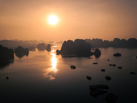 Sunrise at Halong Bay with boats aerial view