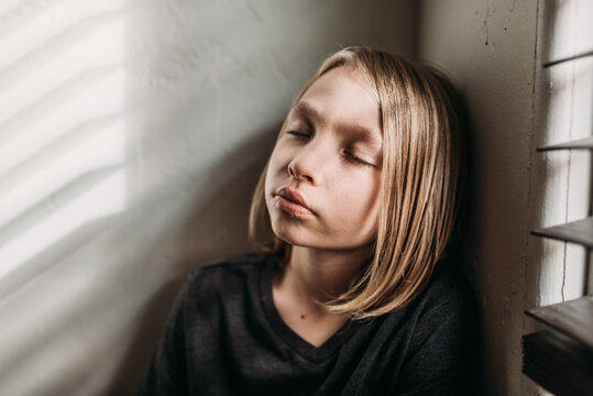 Young boy meditating at home