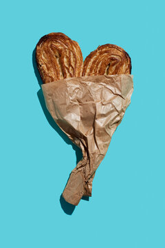 heart-shaped pastry in a paper bag
