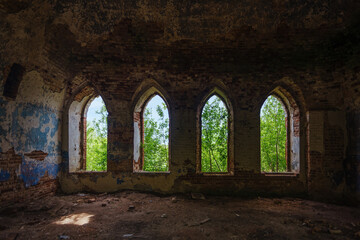 Fototapeta na wymiar Inside the old ruined red brick church in gothic style.