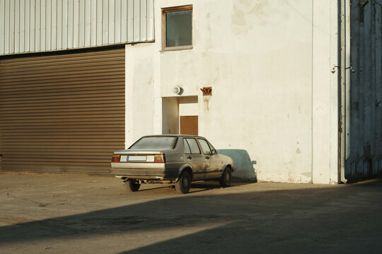 Old car in front of garage