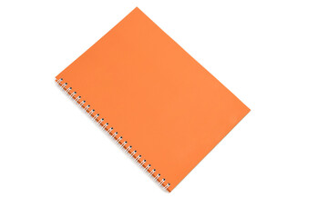A spring-loaded notebook with an orange cover on a white insulated background