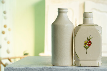 pair of old ceramic jars as a decoration. High key