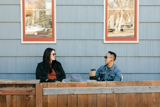 Couple Drinking Coffee on Cafe Patio