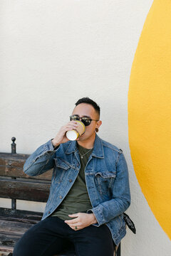 Man Drinking from Coffee Cup