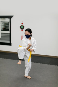Woman Wearing Face Mask and Practicing Kung Fu