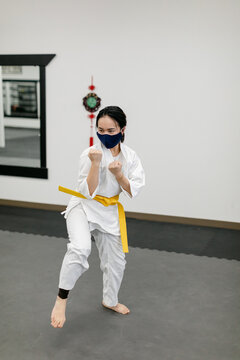Woman Wearing Face Mask and Practicing Kung Fu