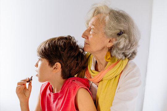 Portrait of colorful grandmother and grandson