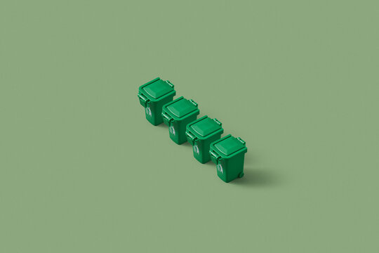 Four small green trash cans