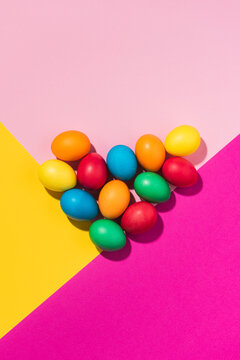 Easter eggs laid out in an abstract design on the colourful background 