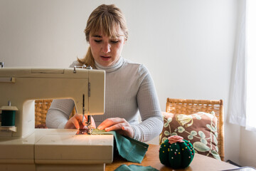 Girl using a sewing machine
