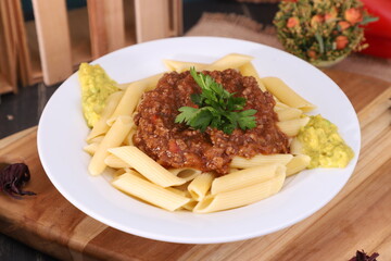 fresh fettuccine with bolognese sauce and guacamole