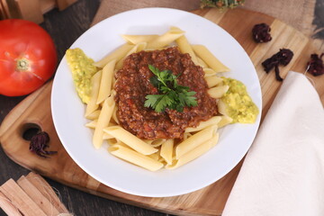 fresh fettuccine with bolognese sauce and guacamole