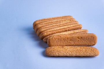 ladyfingers on light blue background