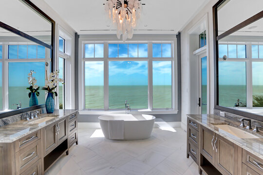 Master Bathroom with Large Windows, Soaking Tub, and a View of the Gulf of Mexico 