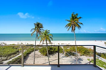 Fototapete Rund Balcony with beach view and palm trees in Florida  © Ray Dukin