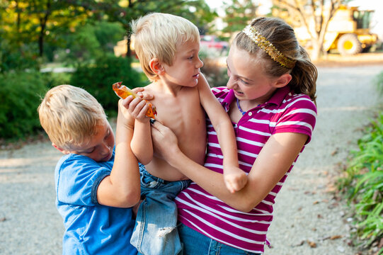 Little Boy Fighting with Siblings