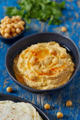 hummus on a wooden surface