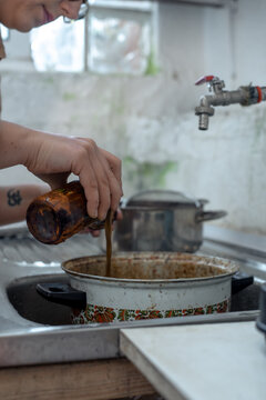 Pouring rust mordant on the fabric