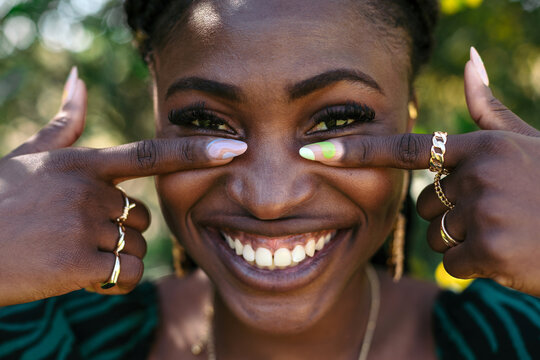 Black woman with colorful nails