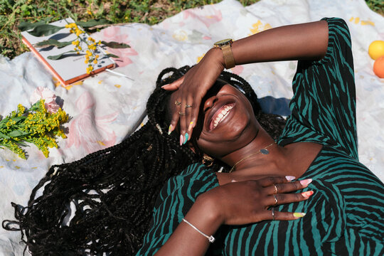 Black woman smiling in the park
