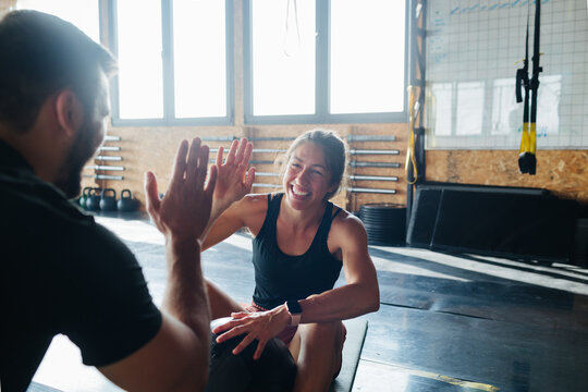 Man and Woman Resting in Gym