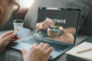 Man hands using laptop computer for online shopping at home, Hand holding credit card and make Payment Detail page display on computer laptop, online shopping concepts.