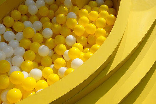 Yellow plastic balls in the playground ball pool