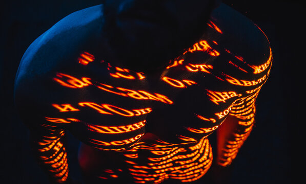 An excerpt in Cyrillic written on a human body