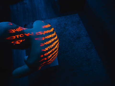 An excerpt in Cyrillic written on a human body