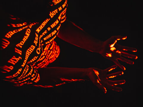 An excerpt in Cyrillic written on a human body