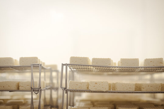 Storage of fresh cheese on racks