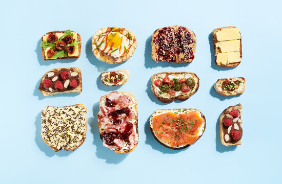 Large Arrangement of Various Toast on Blue Background 