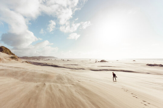 Female silhouette walking at the desert